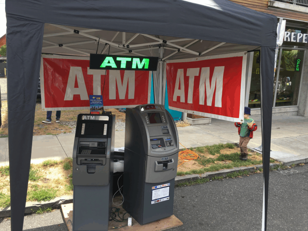 A person taking out cash from an ATM