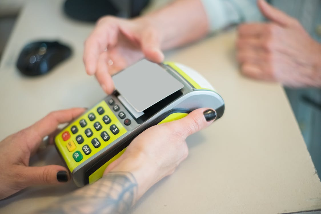 Customer using a cashless ATM terminal