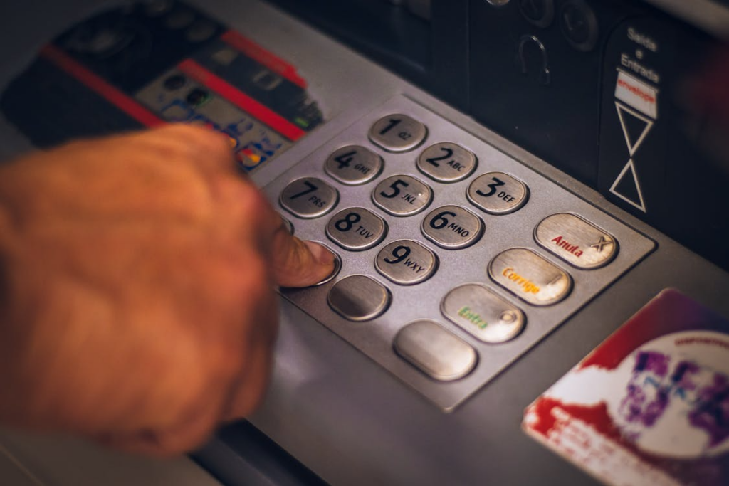 An image of a person entering their ATM pin